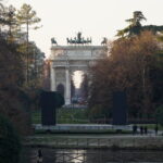 Arco della Pace, or the Arch of Peace in English. It is a neoclassical monument that was built in the early 19th century to celebrate the end of the Napoleonic Wars and the restoration of peace in Europe. The Arch of Peace is located at the end of the beautiful Parco Sempione, a large park that surrounds the Sforza Castle and is one of the largest green spaces in Milan.
