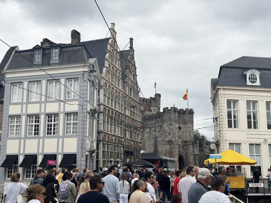 Stepped-gable townhouses and the stone fortress towers of Gravensteen Castle in Ghent