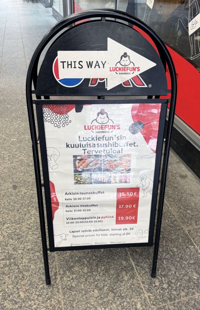 Luckiefun's Sushiboksi all-you-can-eat sushi buffet sign with pricing, Helsinki