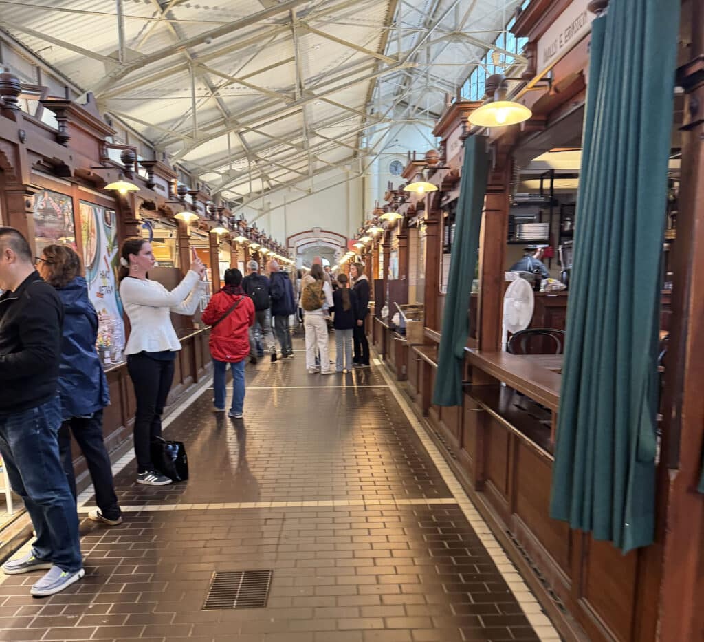 Wood-paneled interior of Helsinki's Old Market Hall with vendor stalls