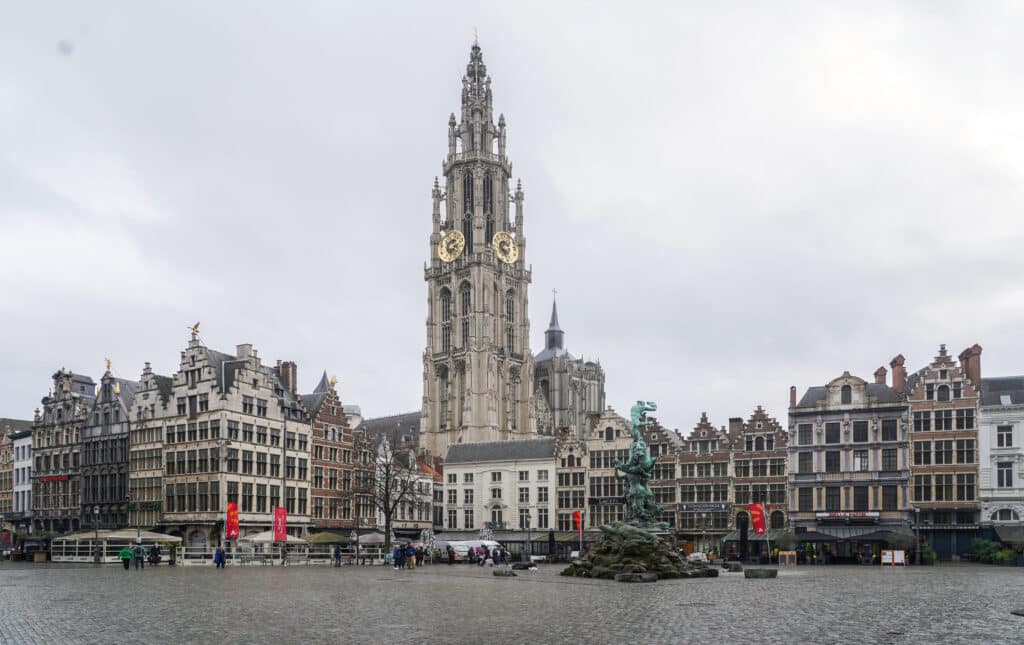 Grote Markt in Antwerp with the cathedral tower rising behind the guild houses and the Brabo Fountain in the square
