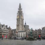 Grote Markt in Antwerp with the cathedral tower rising behind the guild houses and the Brabo Fountain in the square
