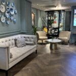 100 Queen's Gate Hotel Curio Collection London Kensington lobby lounge seating and curiosity cabinet