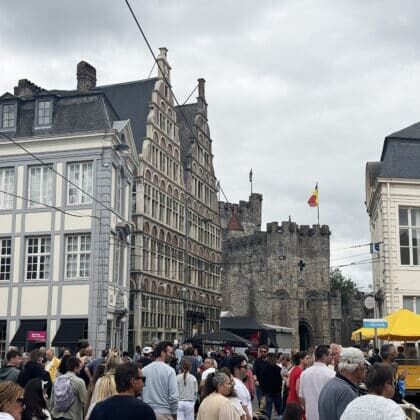 Stepped-gable townhouses and the stone fortress towers of Gravensteen Castle in Ghent