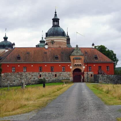 Gripsholm Castle's red brick tower and copper dome viewed from the courtyard